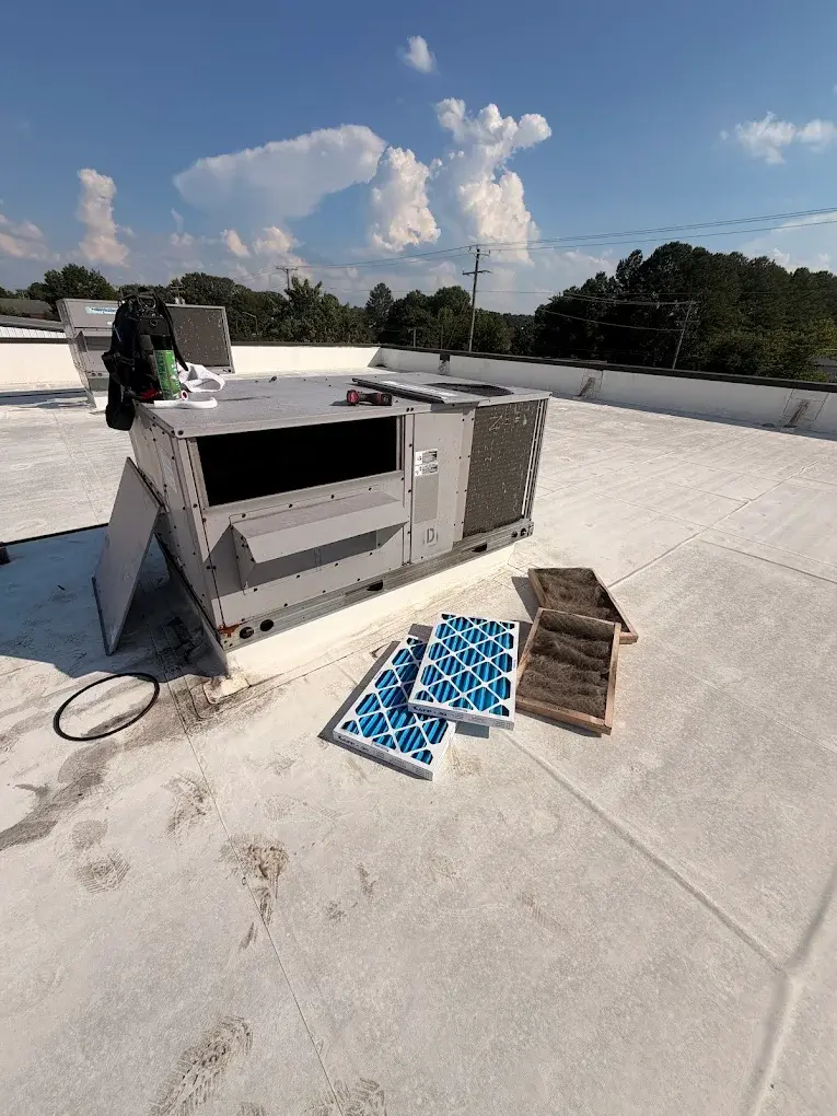 Commercial rooftop HVAC unit prepared for filter replacement and maintenance