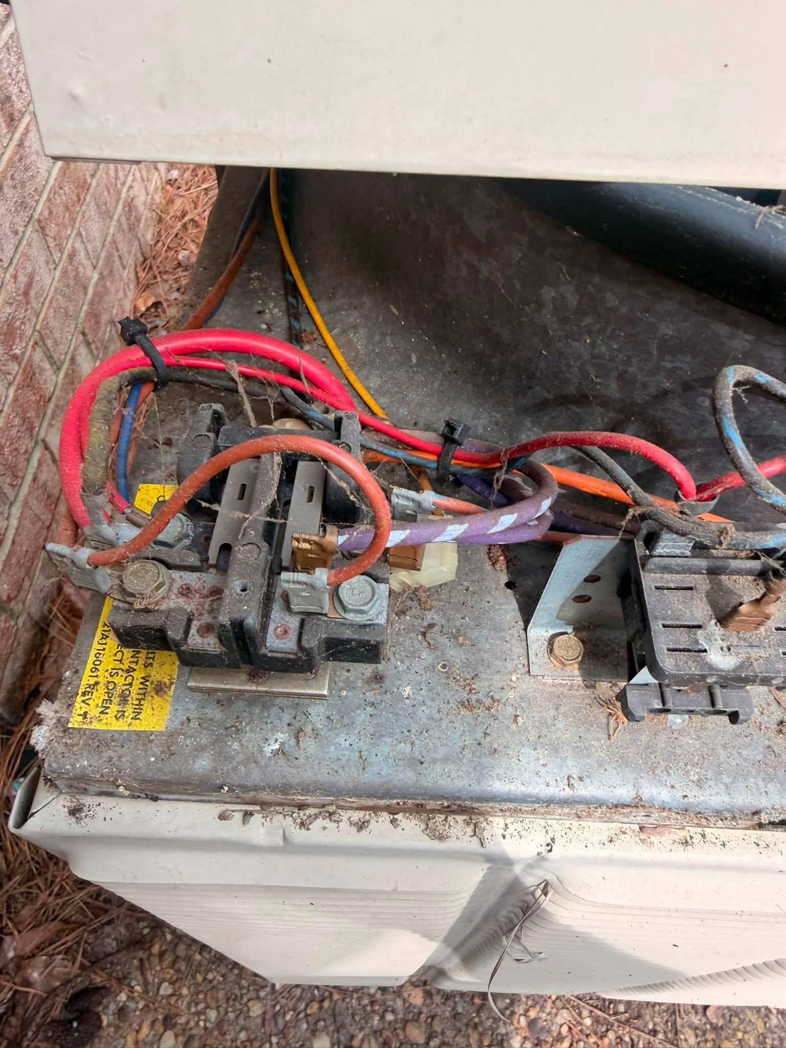 Electrical contactors and wiring inside an outdoor HVAC unit