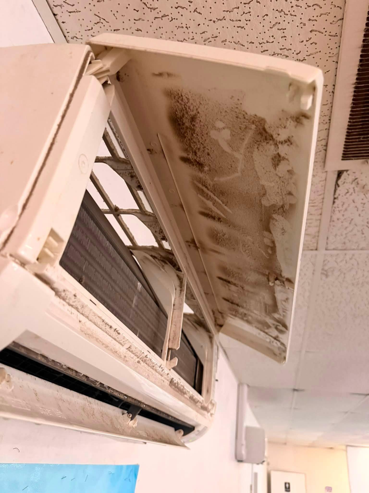 Open ductless mini-split indoor unit during cleaning and service