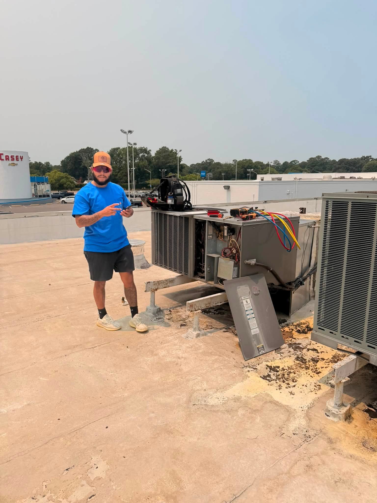 Commercial rooftop HVAC service by a Ferguson & Sons technician