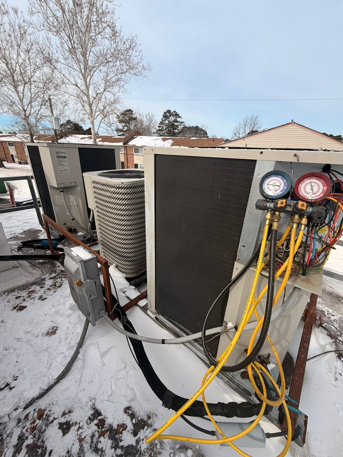 HVAC service gauges connected to equipment