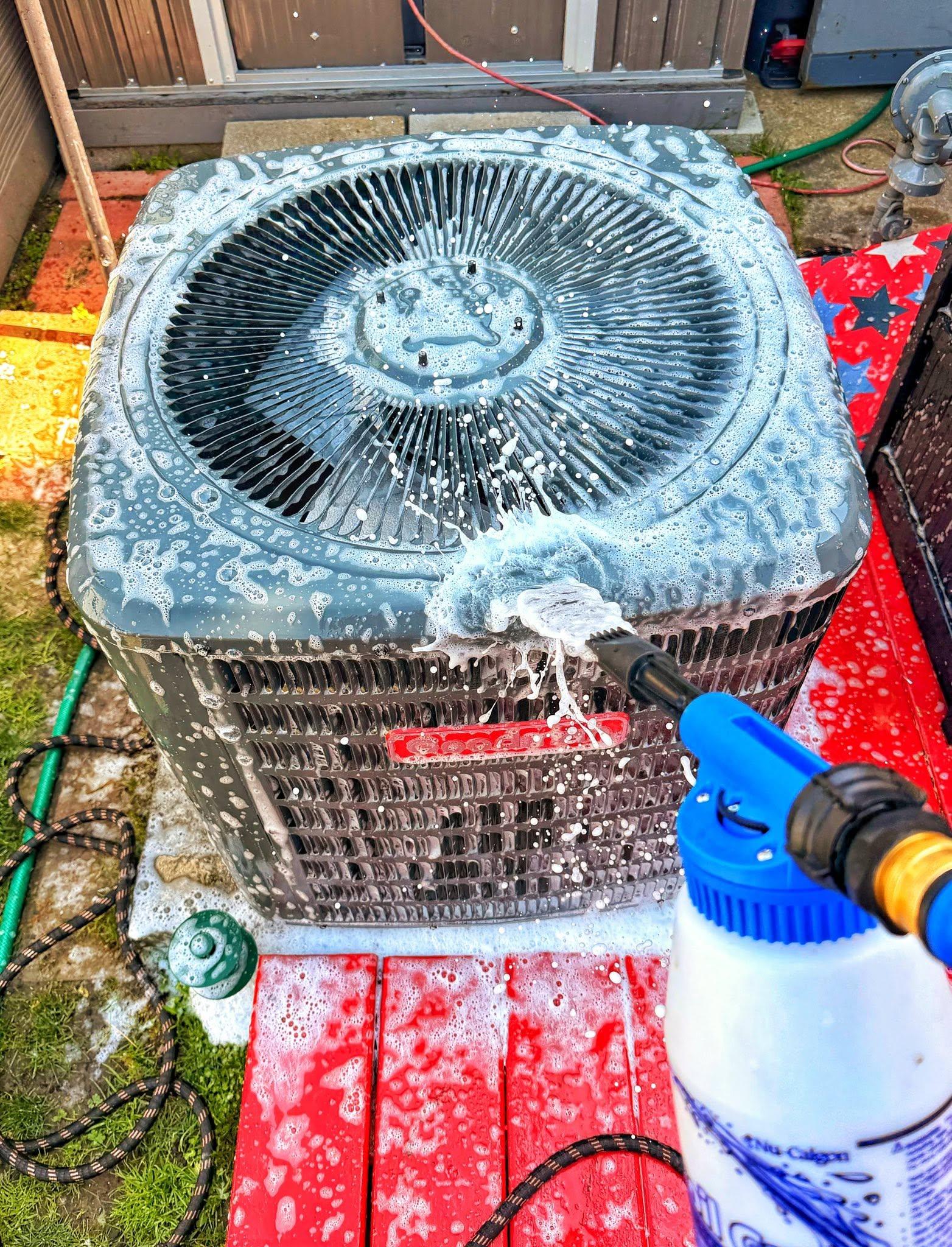 Residential outdoor condenser during deep cleaning