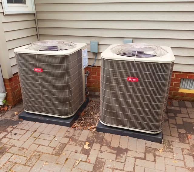 Two residential Bryant outdoor HVAC units